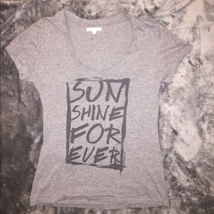 Gray short sleeve shirt with black text